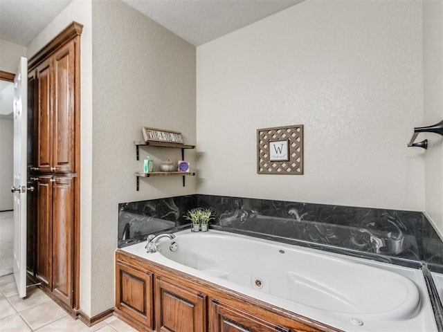 bathroom featuring a bath and tile patterned floors