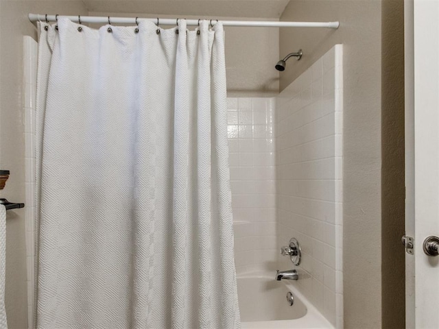 bathroom featuring shower / bath combination with curtain