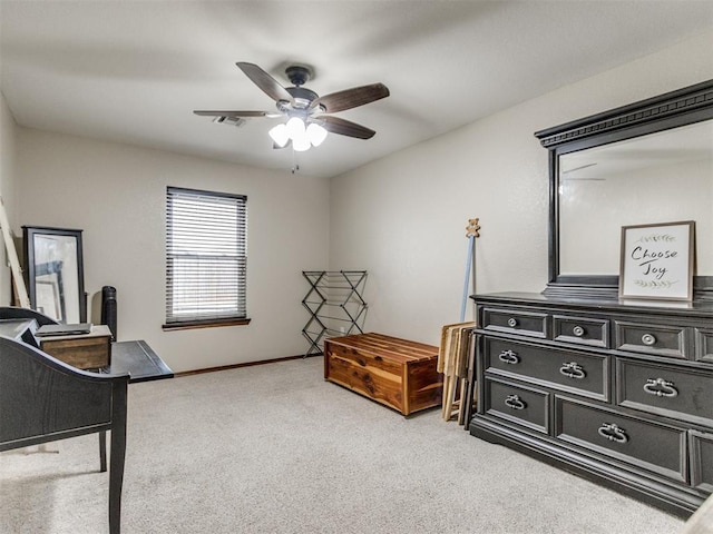 interior space with light carpet and ceiling fan