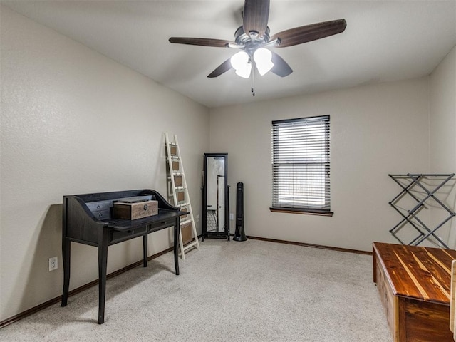 misc room with light colored carpet and ceiling fan