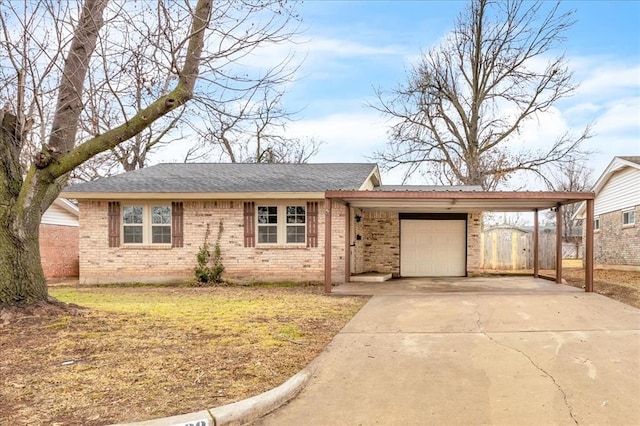 single story home featuring a carport, a garage, and a front yard