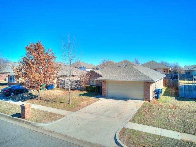 ranch-style home with a garage and a front lawn