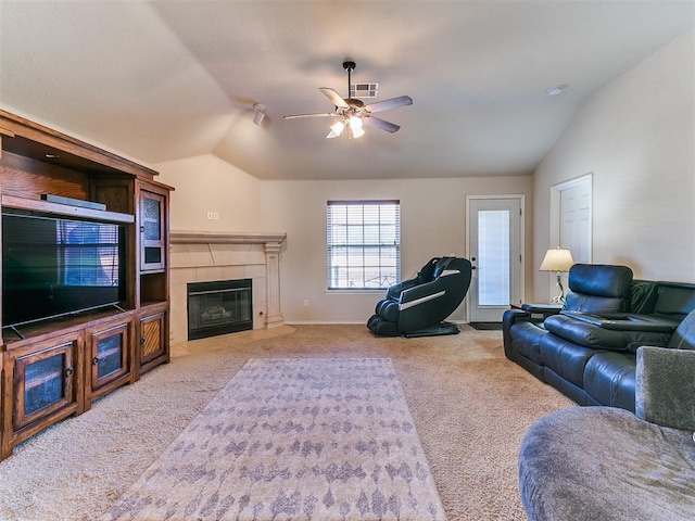 carpeted living room featuring ceiling fan, lofted ceiling, and a fireplace