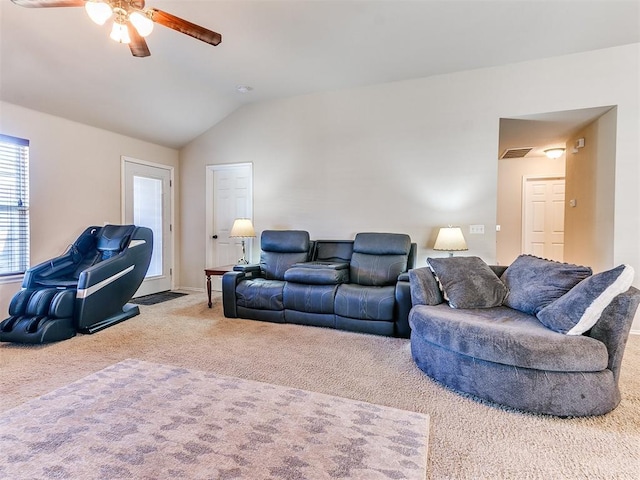 carpeted living room featuring vaulted ceiling and ceiling fan