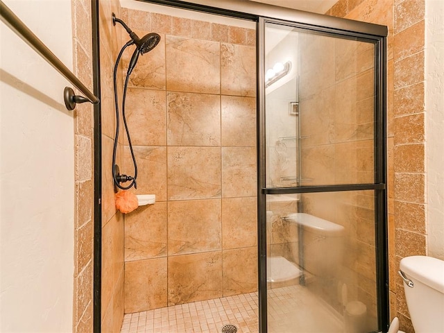 bathroom with a shower with shower door