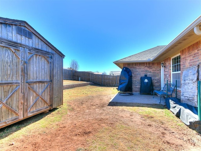 view of yard with a patio area and a shed