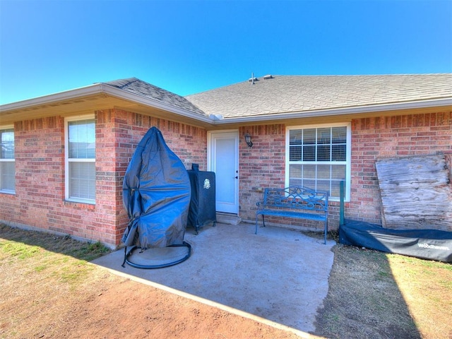 property entrance featuring a patio area