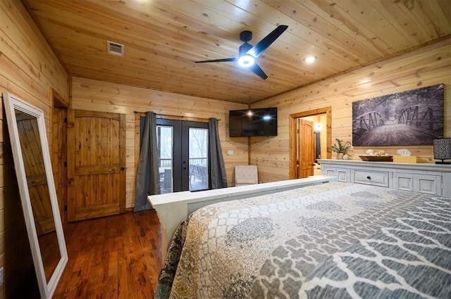 bedroom featuring french doors, wooden walls, wood ceiling, and dark hardwood / wood-style floors