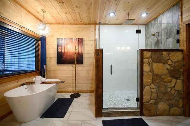 bathroom with plus walk in shower, wooden walls, and wood ceiling