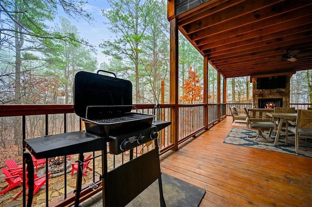 deck featuring a stone fireplace