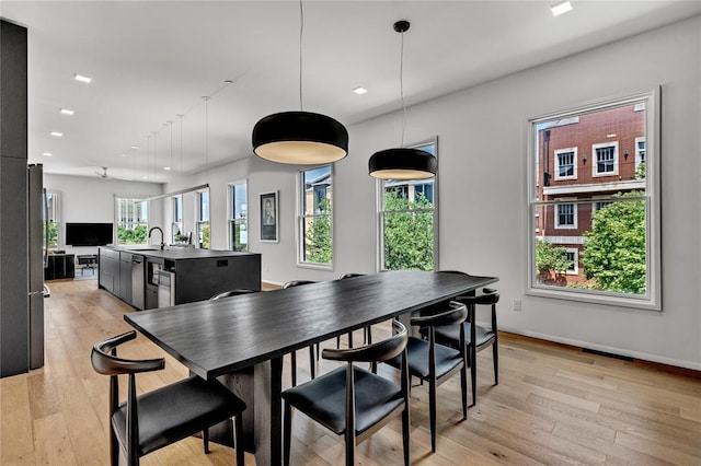 dining space with recessed lighting, baseboards, visible vents, and light wood finished floors