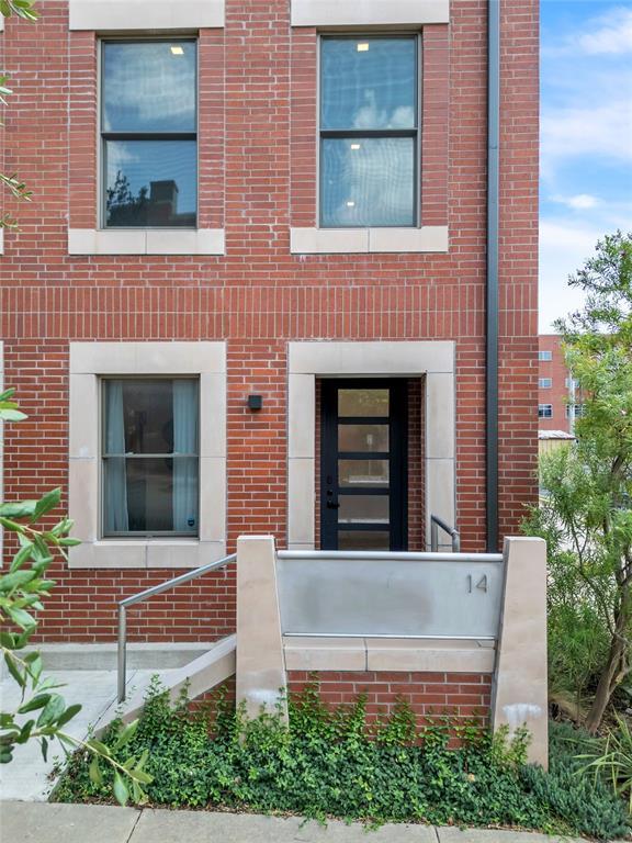 view of front of house with brick siding