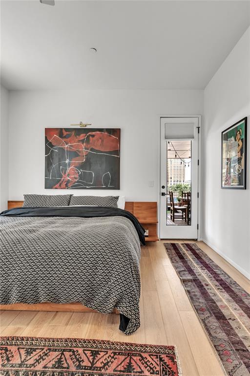 bedroom with hardwood / wood-style flooring