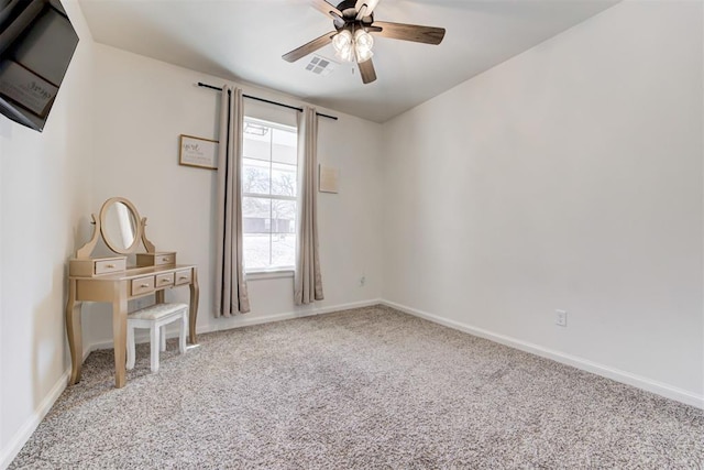 carpeted empty room with ceiling fan