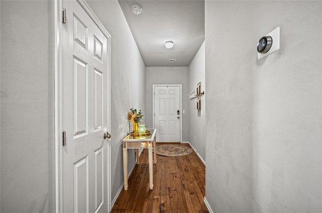 corridor with wood-type flooring