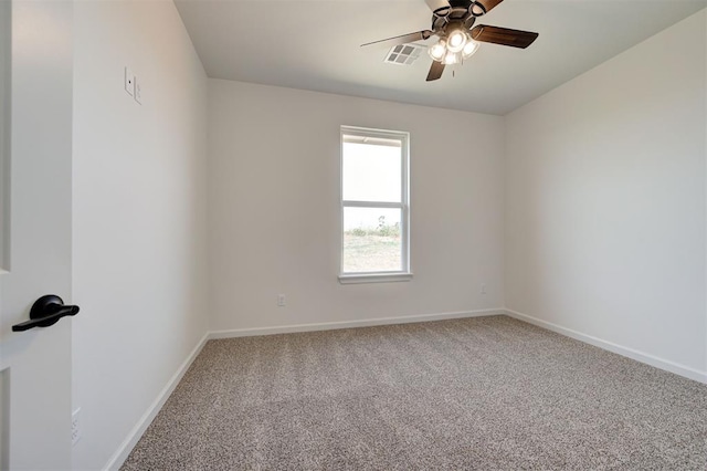 empty room featuring ceiling fan and carpet