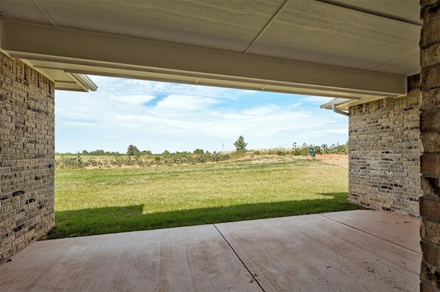 view of yard with a patio and a rural view