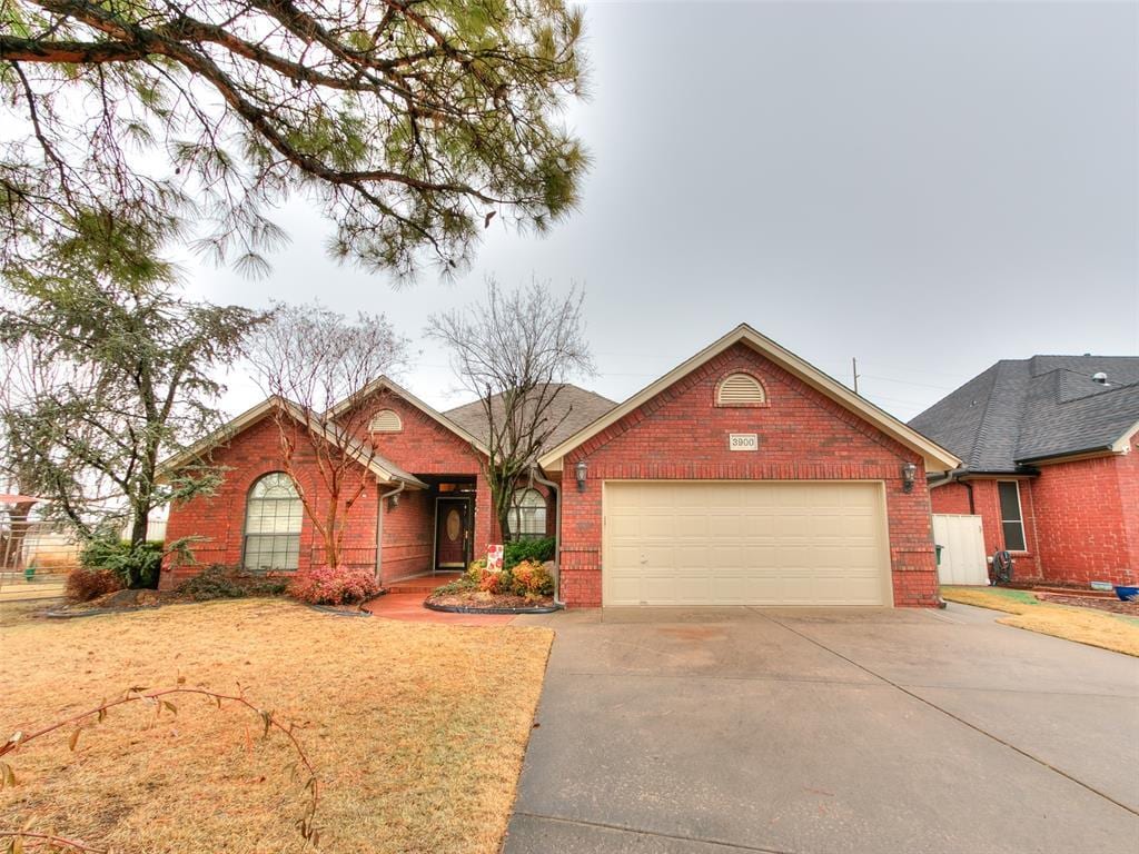 ranch-style home featuring a garage