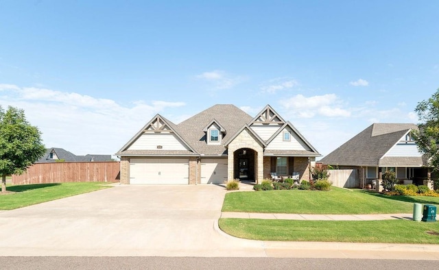 craftsman-style home featuring a garage and a front lawn