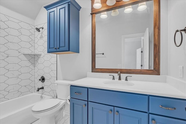 full bathroom with vanity, tiled shower / bath combo, and toilet