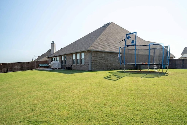 view of yard with a trampoline