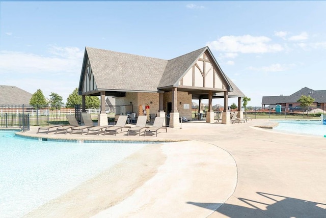 view of swimming pool with a patio