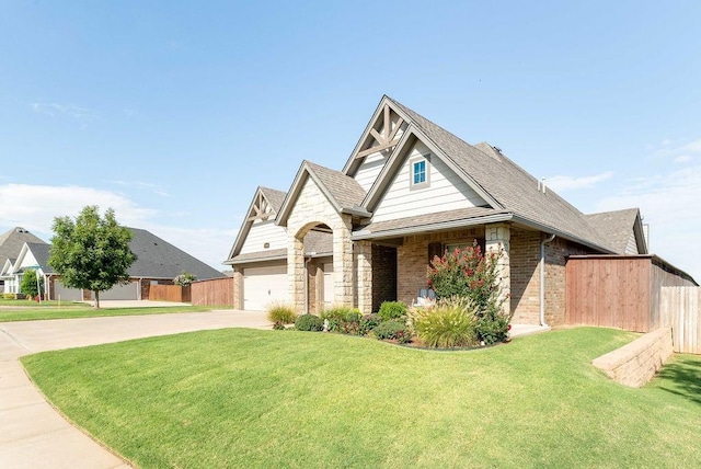 view of front facade featuring a garage and a front lawn