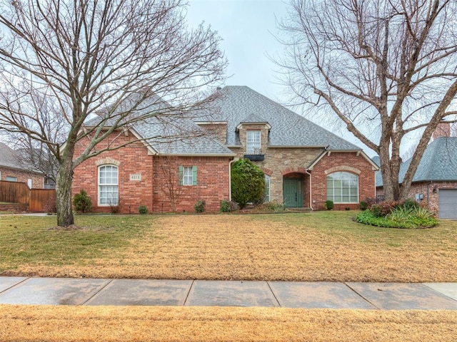 view of front of home with a garage and a front yard