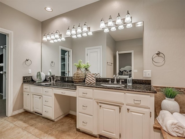 bathroom featuring vanity and tile patterned flooring