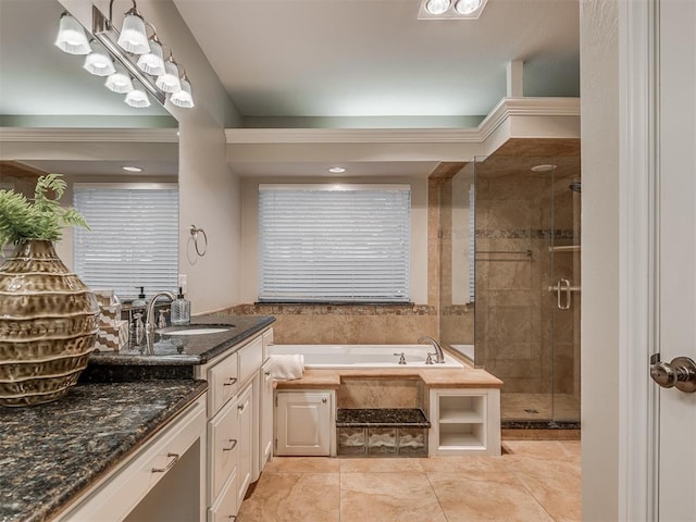 bathroom featuring tile patterned floors, vanity, and plus walk in shower