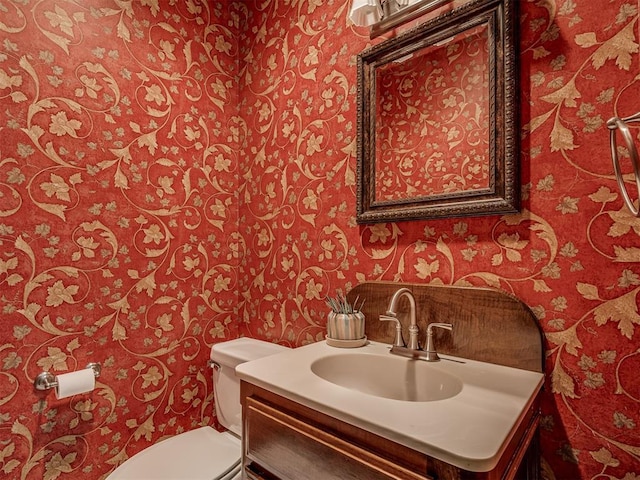 bathroom with vanity and toilet