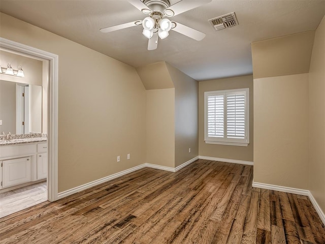 bonus room featuring vaulted ceiling, sink, ceiling fan, and light hardwood / wood-style flooring