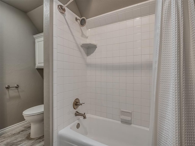 bathroom with shower / tub combo with curtain, wood-type flooring, and toilet