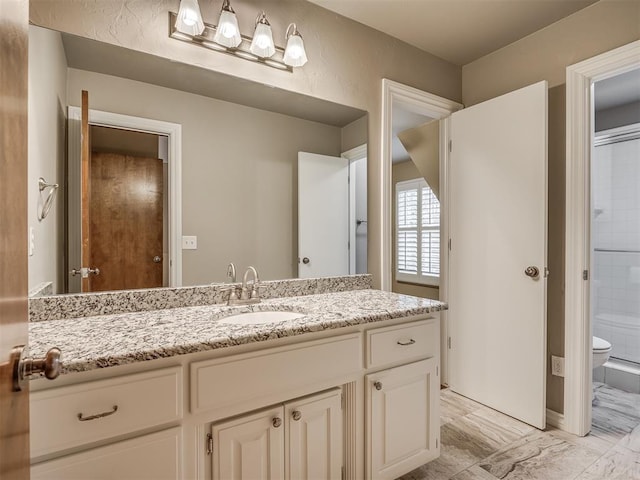 bathroom featuring vanity, toilet, and walk in shower