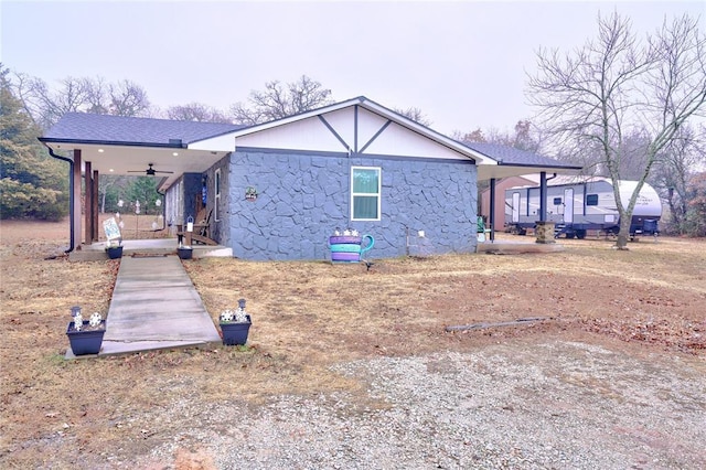 view of front of property with ceiling fan and a porch