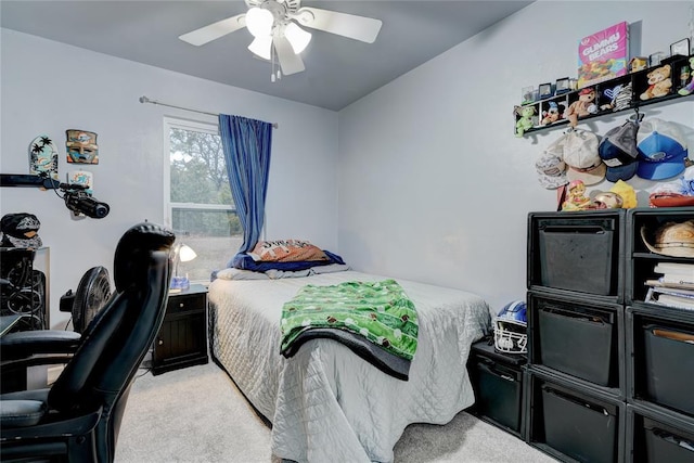 bedroom featuring light colored carpet and ceiling fan