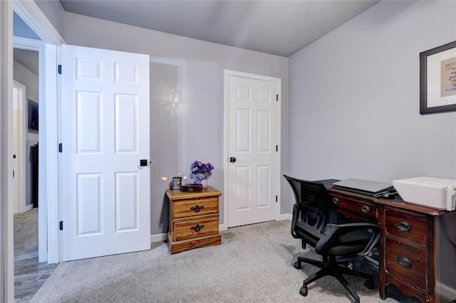 office area featuring light carpet