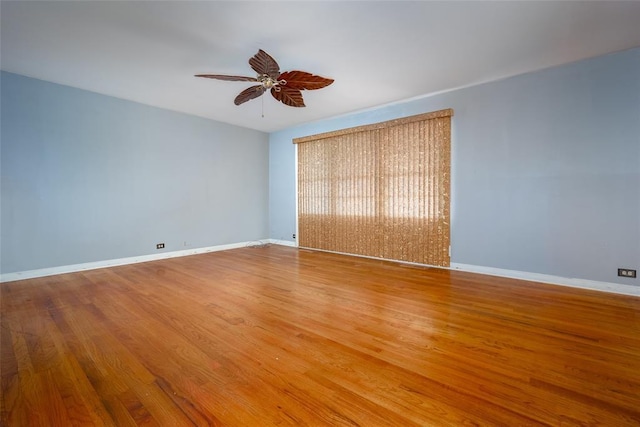 empty room featuring wood-type flooring and ceiling fan