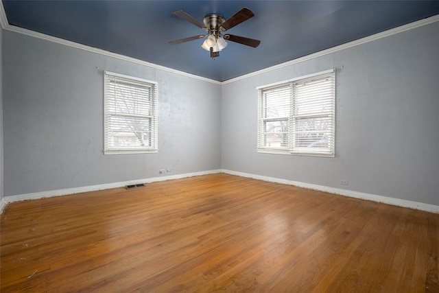 unfurnished room with crown molding, ceiling fan, and hardwood / wood-style flooring