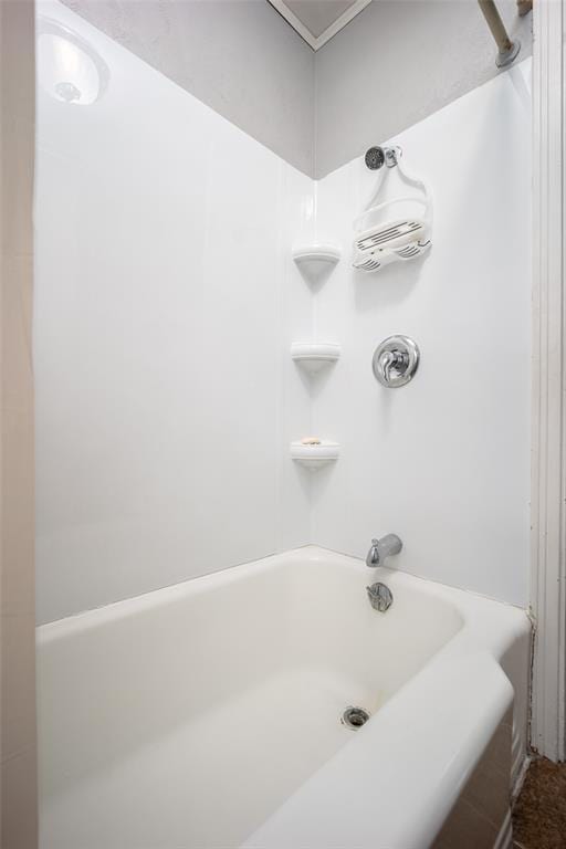 bathroom with washtub / shower combination