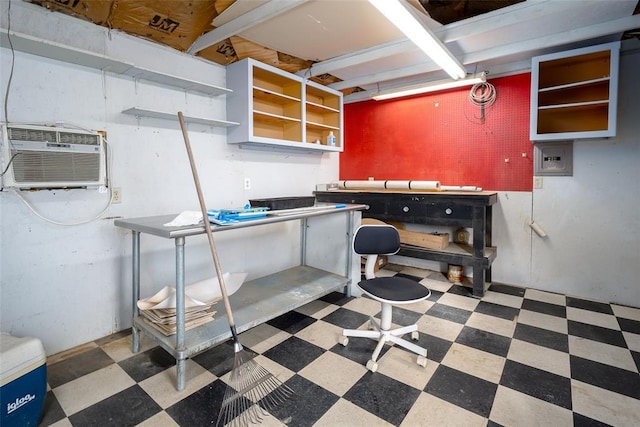 basement featuring an AC wall unit