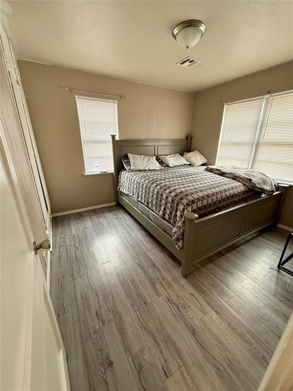 bedroom with light hardwood / wood-style flooring