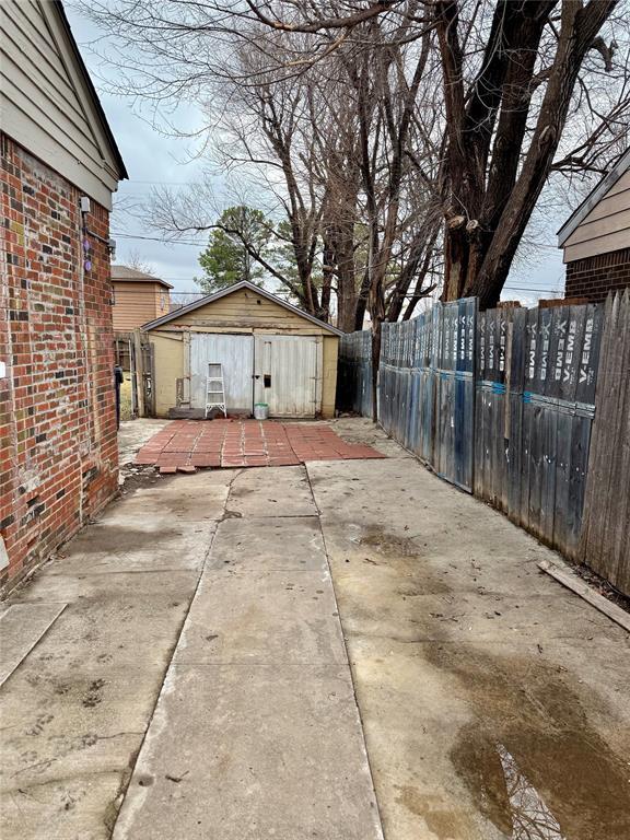 view of patio / terrace with a storage shed