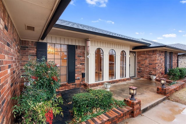 property entrance with a patio area