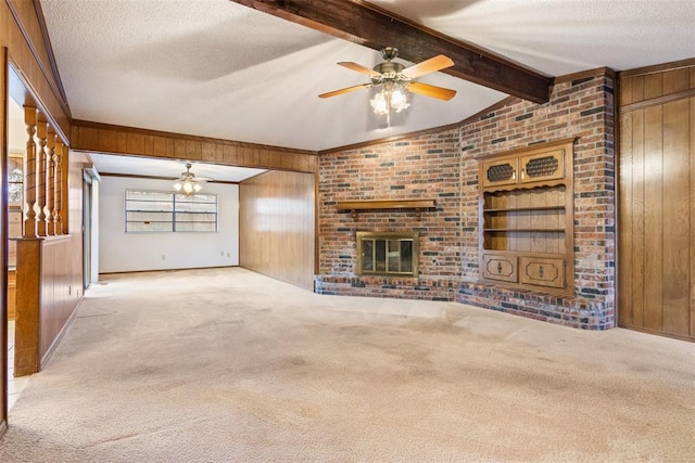 unfurnished living room featuring light carpet and wood walls