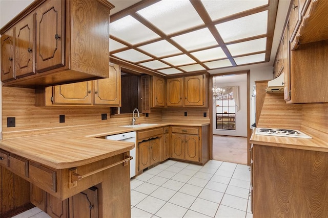 kitchen featuring sink, a chandelier, white appliances, and light tile patterned floors