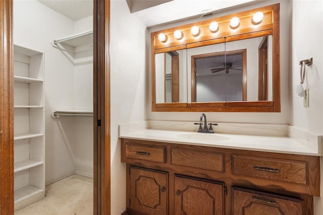 bathroom with vanity and a textured ceiling