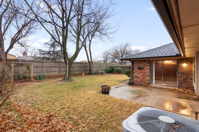 view of yard with a patio and central AC