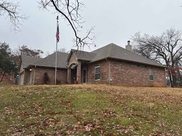 view of property exterior with a yard