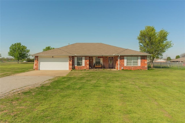 ranch-style home featuring a garage and a front lawn